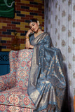 Vsaree Grey Raw Silk Saree With All Over Zari Weaving Pattern And Zari Border And Blouse